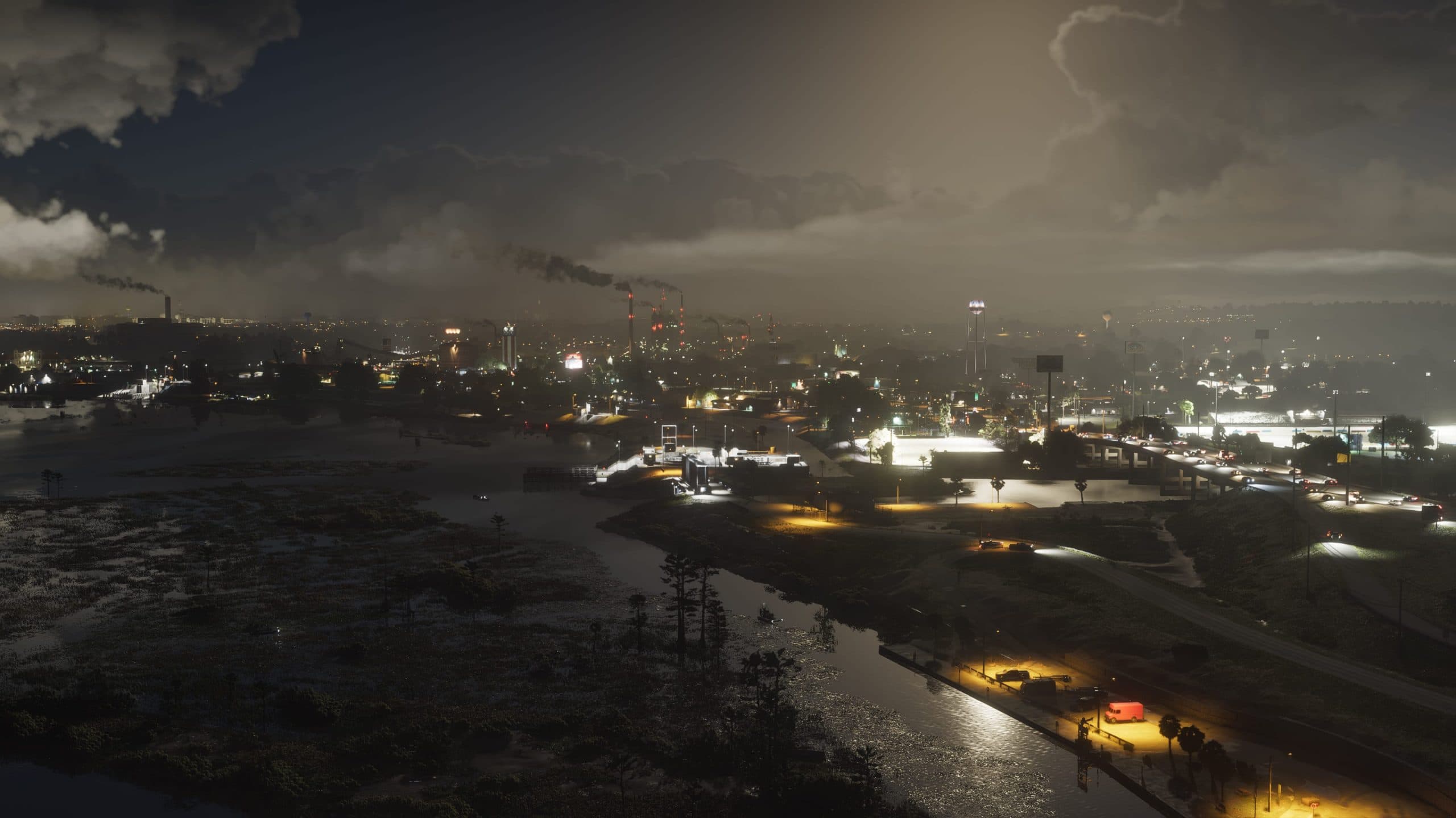 Trailer still: Vice City skyline at night over the water